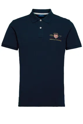 GANT Navy Piqué Polo with Gold Shield Design.